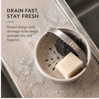 Speckled pedestal sponge holder with silver-tone arched handle holding a sponge and scrubber